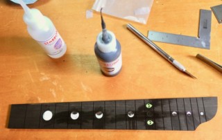 Adding moon inlays to fretboard